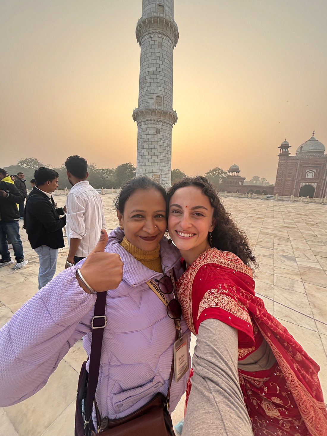 Female guide and traveller at the Taj Mahal at sunrise